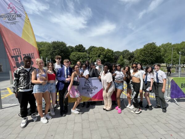 Students sing at Queen's Baton Relay in Derby